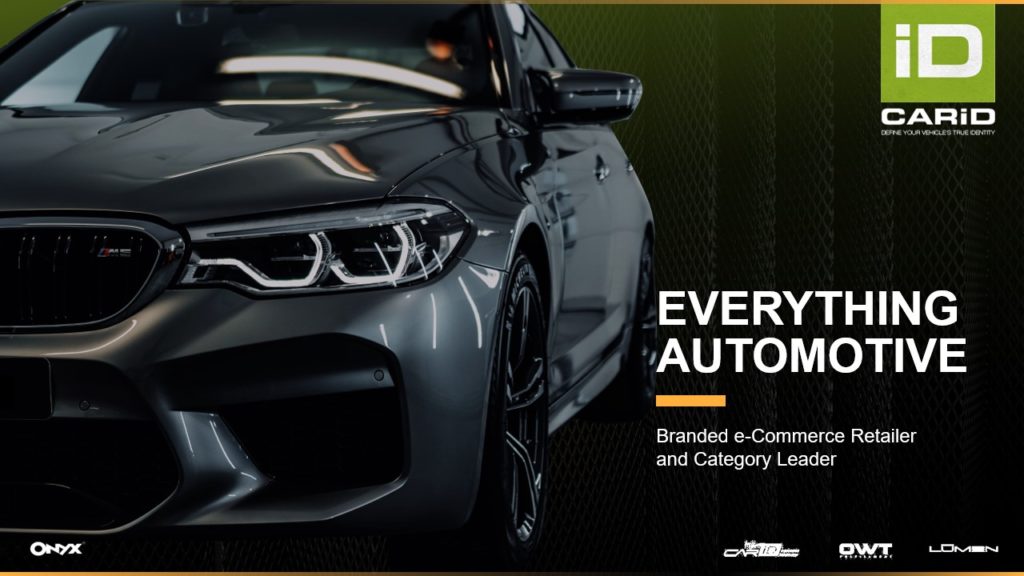 A pitch deck slide of a close-up of a sleek, onyx gray car's front end with bold headlights. Text on the image includes "iD CarID | Everything Automotive," "Branded e-Commerce Retailer and Category Leader." Various logos are visible at the bottom, emphasizing the automotive focus.